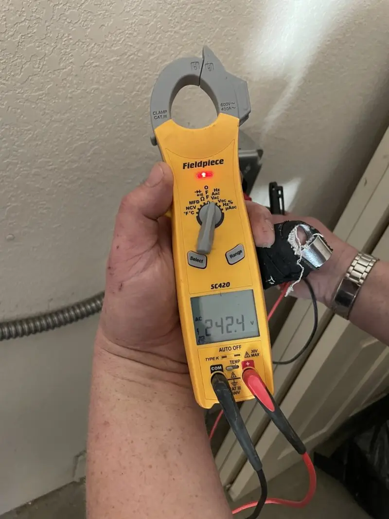 Voltage testing with clamp meter during Whole House Surge Protector in Bandon